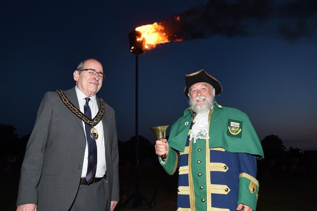 Lutterworth Town Mayor Bill Zilberts with Town Crier Pete Hollingshead with the beacon on Lutterworth recreation ground.