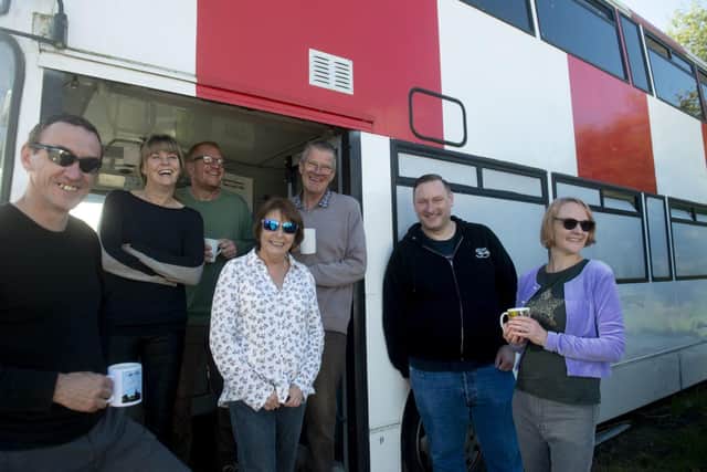 Positive Community Action (PCA) volunteers with the bus
