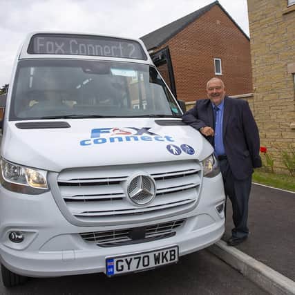Councillor Ozzy O'Shea, county council cabinet member for highways and transport, by one of the FoxConnect vehicles