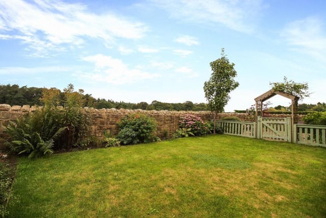 A stunning landscaped garden again mainly laid to lawn with a secure garden section, patio area and views of open countryside.