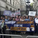 Protesters and their banners. Picture: Olivia Preston