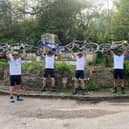 The cyclists celebrate reaching their 100mile goal