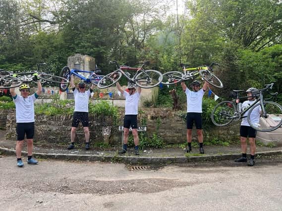 The cyclists celebrate reaching their 100mile goal