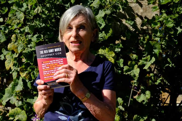 Ros Gallant with her late father's book, The Red Army Moves