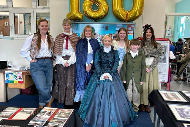 Staff and pupils set the scene in Victorian costume.