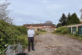 MP Neil O'Brien next to the derelict garages