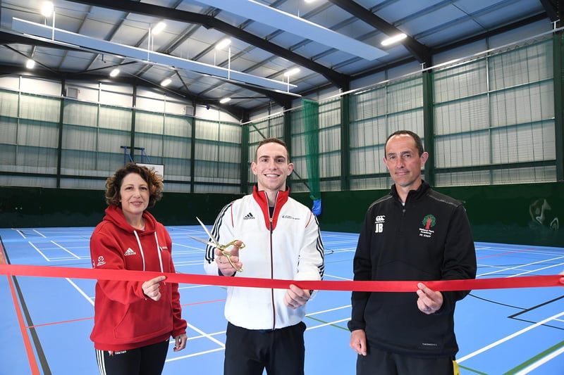 Nada Hankin (active places development Officer at Active Together), Andrew Stamp (former student and Olympic athlete) and PE teacher Jason Button inside the sports hall at Welland Park Academy.