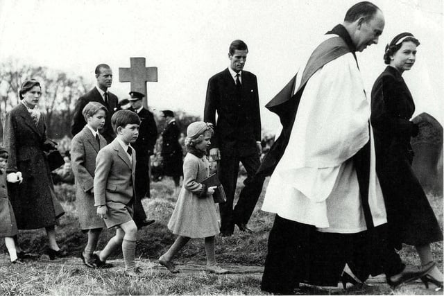H M Queen Elizabeth II and Revd B Moffat Peake, followed by Princess Anne and Prince Charles  25th March 1956. Photo courtesy of David Carter, Lubenham.