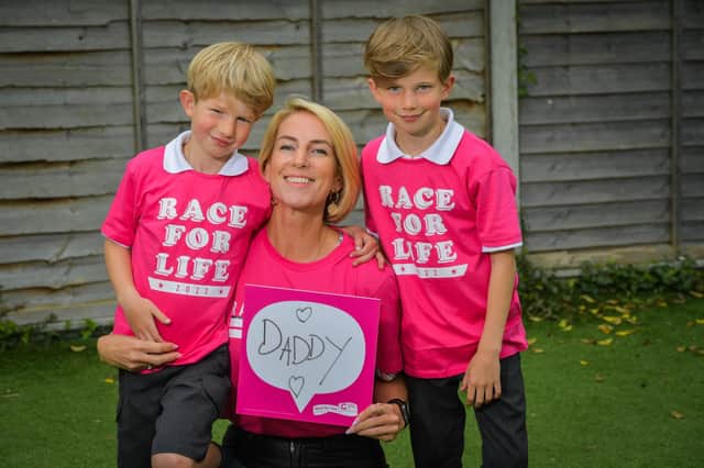 Rebecca Dixon from Market Harborough is doing this year's Race For Life at Stoneleigh in memory of her husband James who dies of kidney cancer in 2019. She is pictured with her sons Brody, 7, and Blake, 5. (Will Johnston Photography).