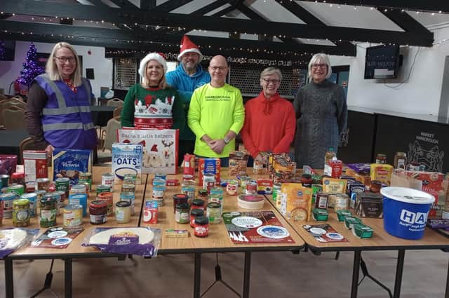 A representative of the town's food bank - Sam Hunt - received the "goodies" from both sporting officials in Gary Brewster and Sarah Joyce, while athletics was represented by Howard Crabtree, Jill Roginski and Mel Brocklebank.