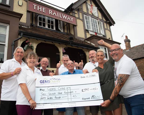 Boost...from left, Andy and Sally Anderson of GEMS charity, Tom Stanbridge, Chris Colin, Jack Harling, Jeff Pearce, Sam Shields landlady and Derek Ward during the presentation at The Railway in Kibworth.
PICTURE: ANDREW CARPENTER