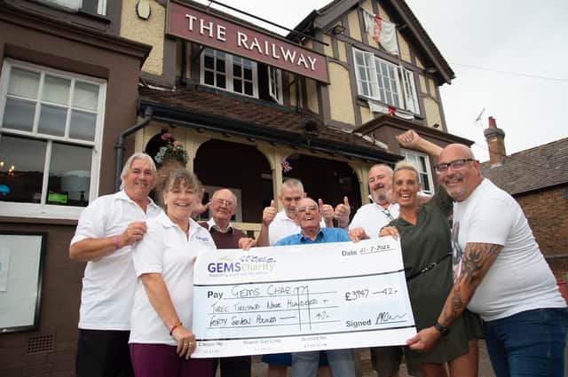 Boost...from left, Andy and Sally Anderson of GEMS charity, Tom Stanbridge, Chris Colin, Jack Harling, Jeff Pearce, Sam Shields landlady and Derek Ward during the presentation at The Railway in Kibworth.PICTURE: ANDREW CARPENTER