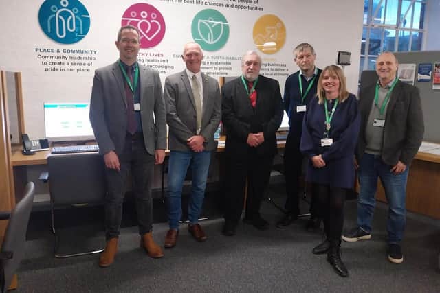 Members of the council's cabinet at the self-service point in The Symington Building