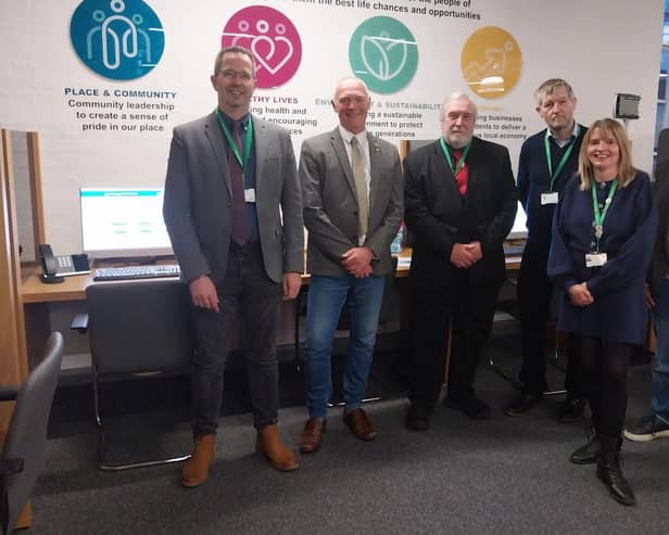 Members of the council's cabinet at the self-service point in The Symington Building