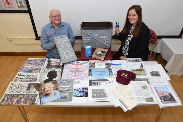 Bob Morris chairman of Gilmorton History Group with Vicki Otway head of school with the contents of the time capsule.
PICTURE: ANDREW CARPENTER