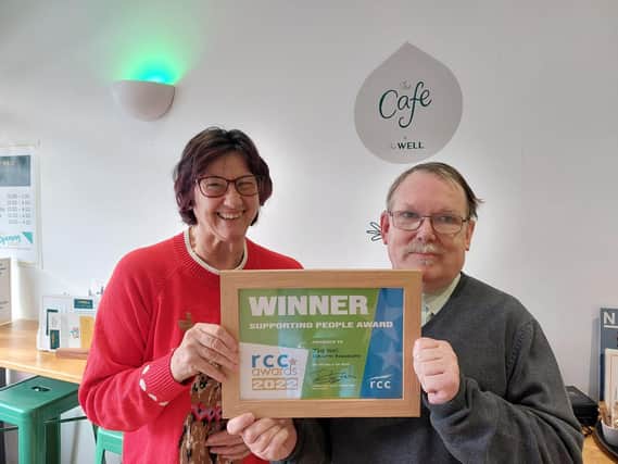 Volunteers Rebecca and Timothy with the Supporting People Award.
