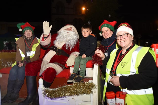 Harry Cohen meets Santa and his helpers on the 3rd Market Harborough Scouts sleigh.