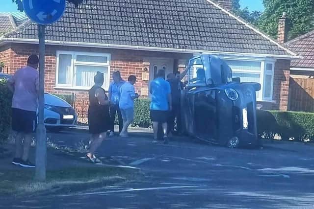 A person was taken to hospital after a car overturned in a two-car crash in Market Harborough today (Wednesday). Photo courtesy of HFM.