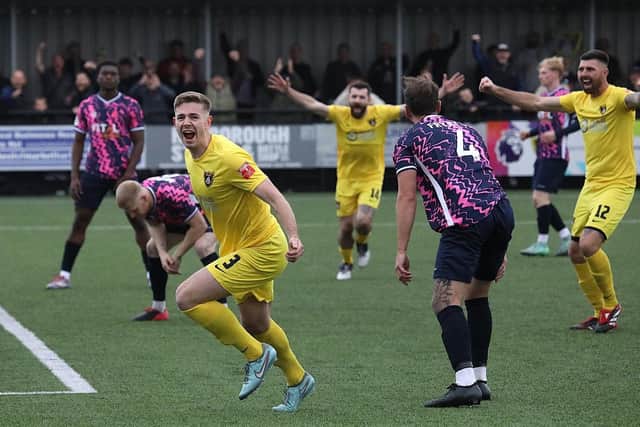 A delighted Josh Walsh gets ready to celebrate after firing Harborough Town into a 2-0 lead against Peterborough Sports (Picture: Phil Passingham)