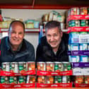 Bruce Harrison of South Leicester Foodbank warehouse in Wigston with Iain Kirkpatrick of MHBS