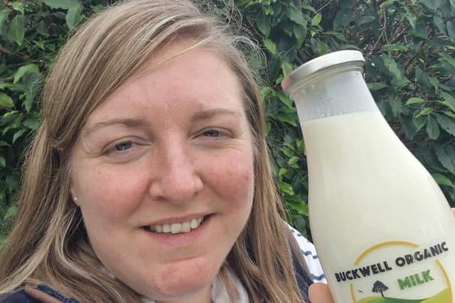 Milly Fyfe with a bottle of the organic milk from Buckwell Organic