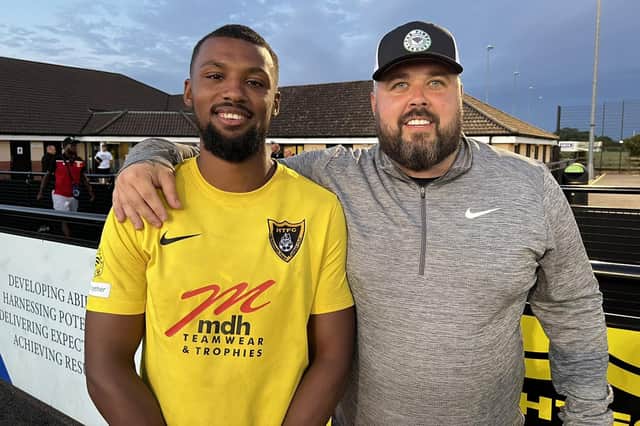 Boss Mitch Austin welcomes one of his newest recruits Spencer Edwards. Picture courtesy of Harborough Town FC
