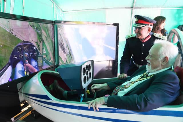 Chairman of Leicestershire County Council Kevin Feltham flies a glider simulator.
PICTURE: ANDREW CARPENTER