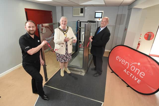 Chairman of Harborough District Council councillor Barbara Johnson cuts the ribbon with Ned Payne of Everyone Active and councillor Roger Dunton.