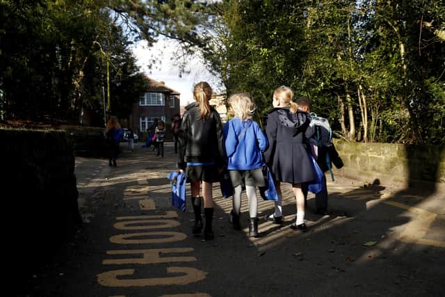 Children walk home from school. (Photo by Clive Brunskill/Getty Images)