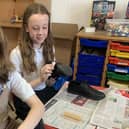 Pupils learn how to shine shoes