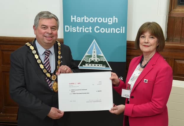 Outgoing council chair Neil Bannister handed over £3,000 Janet McMillan of Leicestershire and Rutland branch of MND Association.
PICTURE: ANDREW CARPENTER