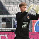 Harborough goalkeeper James Dadge has been recalled from his loan spell by parent club Northampton Town
