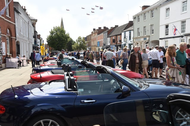 The Red Arrows fly over Market Harborough during the classic car show.