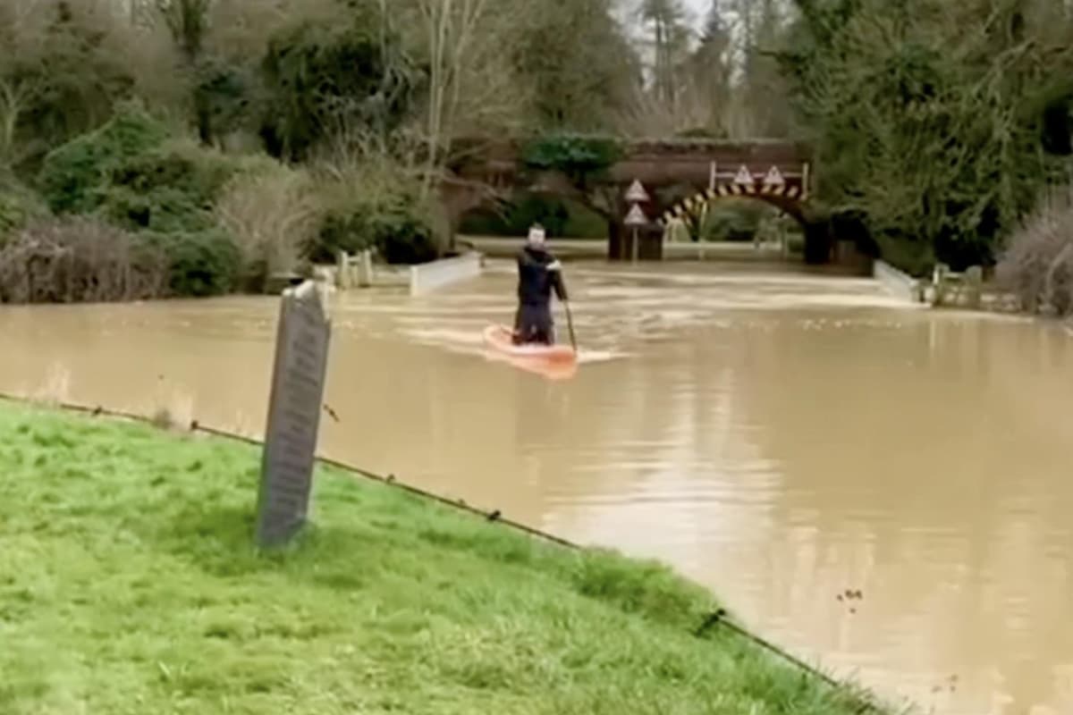 Watch: Paddleboarder makes the most of the flood waters as parts of the Harborough area go underwater 