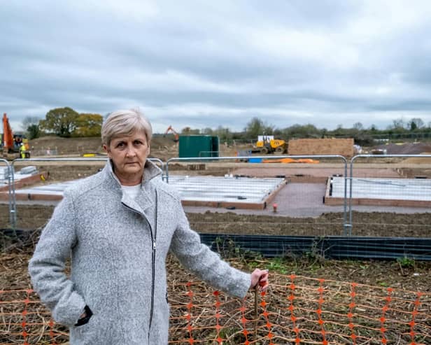 Jeanette Reid, 60 at her home in Desborough, where her hedge on her drive has been removed by housing developers.