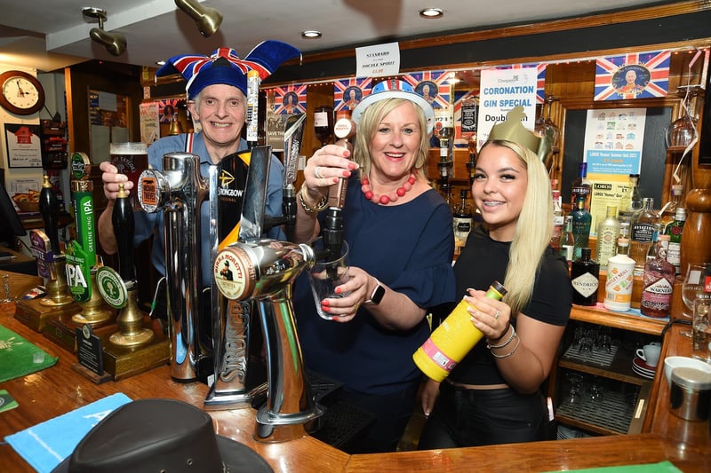 Coronation tipple...Brian Priest landlord, Tracey Waggsteffe and Aimee Taylor during the Coronation party at the Chequers Pub in Swinford.