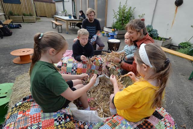 School children join in during the launch of The Bean Project at the Eco Village during live thrashing of haricot beans.
PICTURE: ANDREW CARPENTER