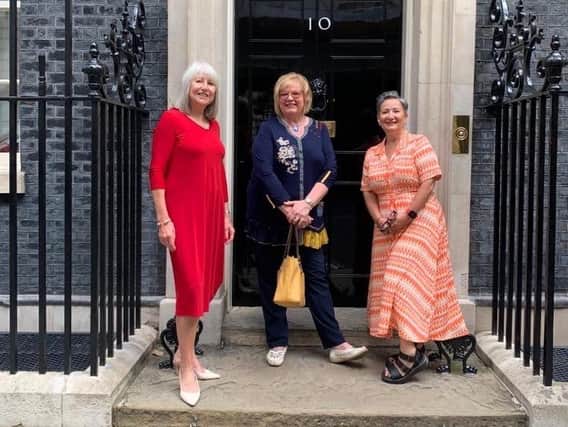 Angela Farrow (centre) with Home Instead colleagues outside Downing Street