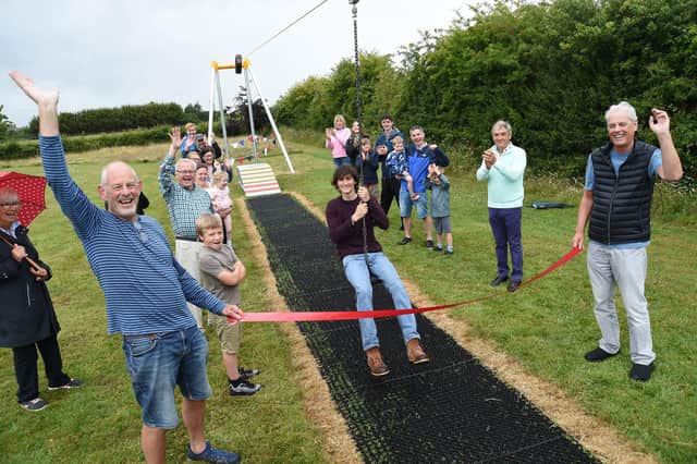 Centre, Arthur Eastmond opens the new zip wire.