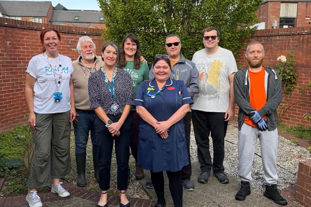 Jill's family with volunteers inside the garden. Picture: LEICESTERSHIRE PARTNERSHIP NHS TRUST
