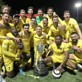 The Harborough Town players celebrate their Hinchingbrooke Cup success on Wednesday night. Picture courtesy of Harborough Town FC