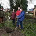 Far right, Beth Garrard plants a Holm Oak with, Gill Wollerton, Vicki Bray chairman, Mike Huxley, Jayne Huxley and Clive Garrard.