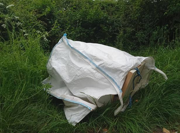 This old fridge packed with stinking frozen food has been dumped in beautiful countryside near Market Harborough.