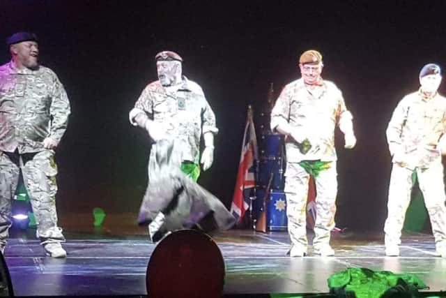 Army veterans put on a show during their Full Monty performance.