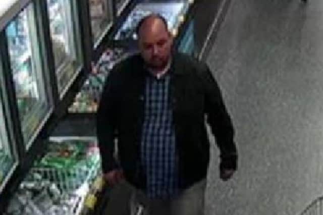 Officers would like to speak to the man pictured following the theft of a purse in Market Harborough.