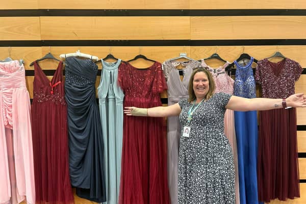 Nicki Burgess of Welland Park Academy with some of the prom dresses.