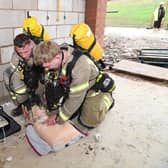 Market Harborough firefighters simulate a life-saving condition. 
PICTURE: ANDREW CARPENTER