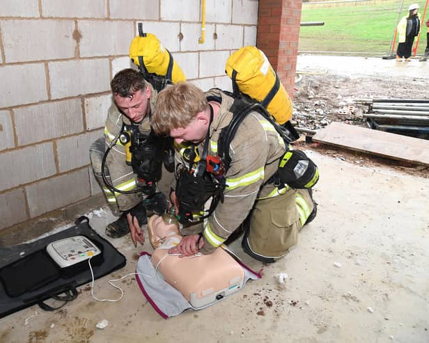Market Harborough firefighters simulate a life-saving condition. 
PICTURE: ANDREW CARPENTER