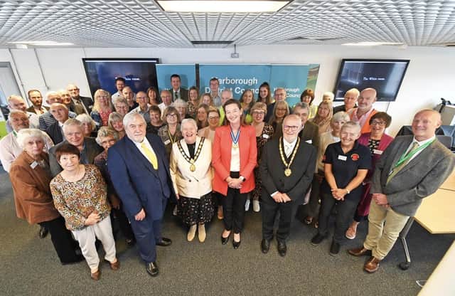 The High Sheriff of Leicestershire with volunteers at Harborough District Council offices
