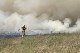 Firefighters from Desborough battled to tackle a fierce blaze which ripped through farmland yesterday afternoon (Thursday).